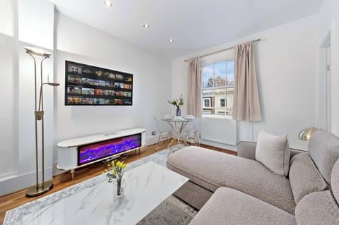 Gather with family for unforgettable movie nights in a spacious living room designed for comfort.