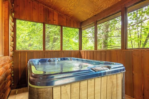 Sink into warm, bubbling water while gazing at lush forest views—your private woodland sanctuary awaits.