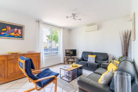 Open living and dining area with air conditioning and garden view