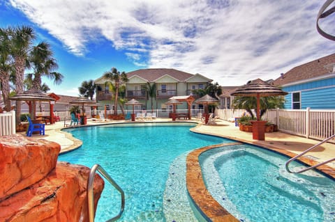 Stunning resort-style pool with tropical landscaping and comfortable lounge areas for your perfect vacation retreat.
