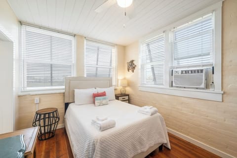 Unwind in your spacious bedroom where natural light streams through windows and a ceiling fan keeps you comfortable.