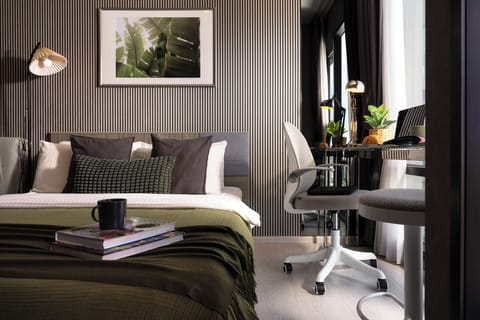 【The Whole Studio】30 sqm studio with floor-to-ceiling windows and a 2.6 m ceiling. Queen bed, real desk, kitchenette with a TCL washer-dryer, 500 Mbps fibre Wi-Fi. A whole condo, not a hotel room.