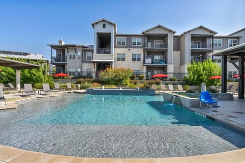 Community Resort-Style pool with handicap accessible chair