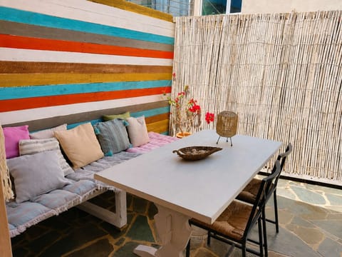 Comfortable outdoor seating invites you to slow down, enjoy a meal in the open air and embrace the relaxed pace of island life.