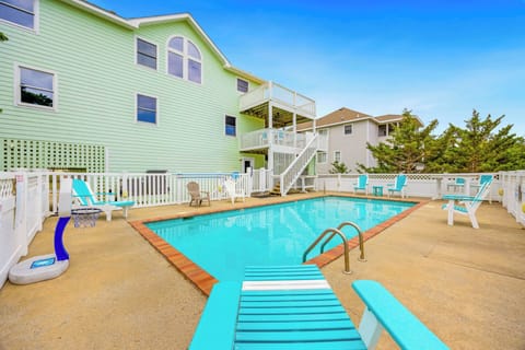 Picture yourself lounging poolside in your private oasis, where bright turquoise waters and sunny skies invite you to relax completely. The spacious deck offers plenty of room for sunbathing and gathering with loved ones.