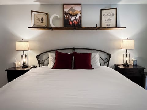 Sink into crisp linens and plush pillows after a day exploring. Your cozy mountain-themed bedroom awaits with elegant touches and warm ambient lighting for restful evenings.