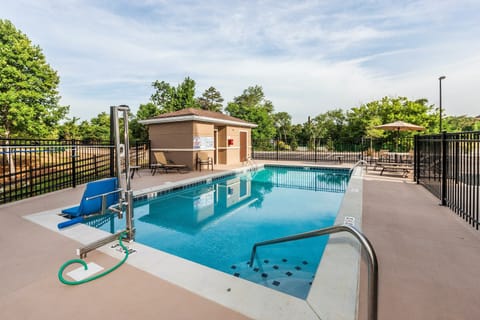 Heated outdoor pool with seating nearby — open seasonally for a cool-down between your Turkey Creek adventures