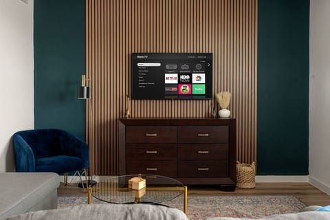 Entertainment area with dresser and TV