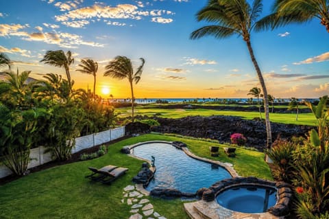 Stone pathways wind through the lush yard, taking you directly to the pool