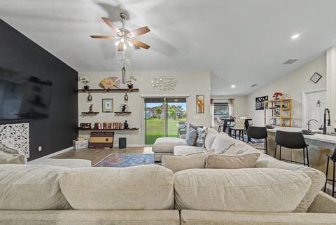 Living Room | Sectional Sofa | Backyard Access & Dining Area