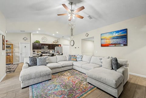 Living Room | Sectional Sofa | Open Kitchen Layout & Ceiling Fan