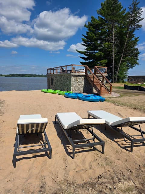 Lounge on the beach while the family plays in the lake