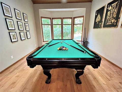Professional Princeton 8ft billiard table. The room is outfitted with unique décor to set the ambiance.