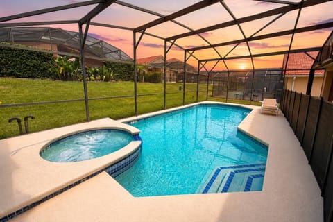 Fully enclosed private pool and spa with safety fence and lounge and dining seating