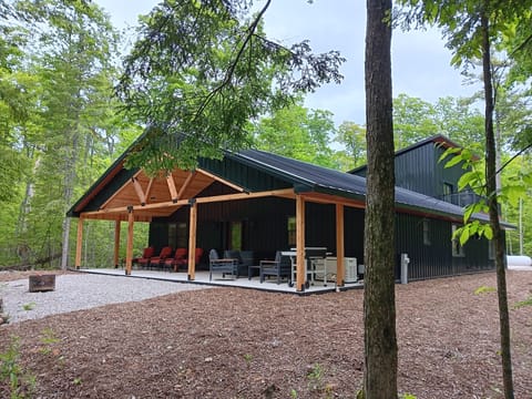 back porch plenty of seating. Grill, fire pit, wood rack. Generator back up.