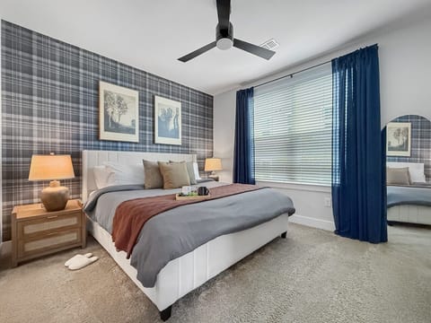 Spacious master bedroom, featuring a king-size memory foam mattress and a private en-suite bathroom for added comfort and convenience