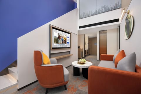 Business Studio Suite, Mountain View | Living area | 50-inch LCD TV with cable channels, pay movies, smart speakers