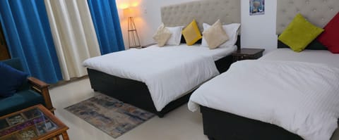 Deluxe Triple Room | Laptop workspace, iron/ironing board, free WiFi