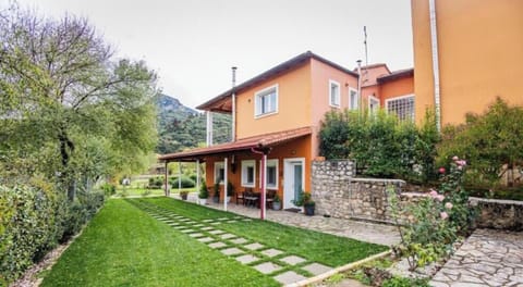 Accommodation's entrance with garden and outdoor seating area