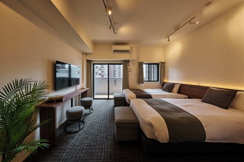 Twin Room | Blackout drapes, iron/ironing board, WiFi (free), bed sheets