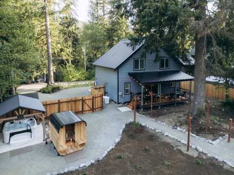 Your Mountain Escape: Enjoy a cedar sauna, covered hot tub, and thoughtfully designed outdoor area after a day exploring Mt. Rainier.