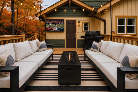 The back deck at the Woodlawn Tailgate offers a cozy fire table, tv & grill!