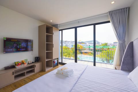 Deluxe Room, Balcony, Pool View | Desk, blackout drapes, WiFi (free), bed sheets