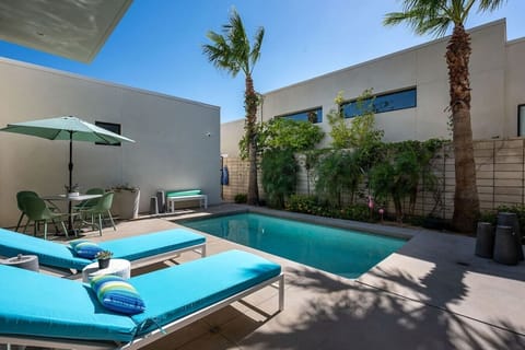 Pool Area: (2) sun chaise loungers, 4-person dining table with umbrella, outdoor shower, natural gas stainless steel grill