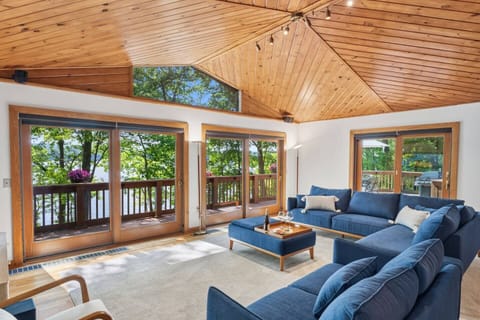Sunlit living room with beautiful lake views.