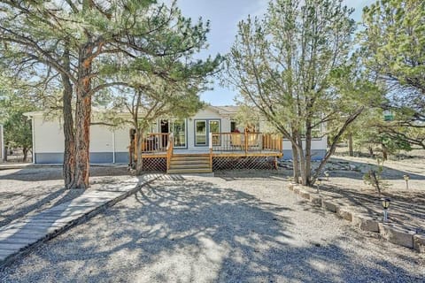 Home nestled into the pinon trees creating a secluded retreat, and offering ample parking, expansive views of the Collegiate Peaks, oversized porch with grill and outdoor dining. 