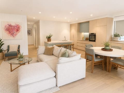 Bright open-plan living with stylish coastal interiors, a fully equipped kitchen, and comfortable spaces to relax and connect.