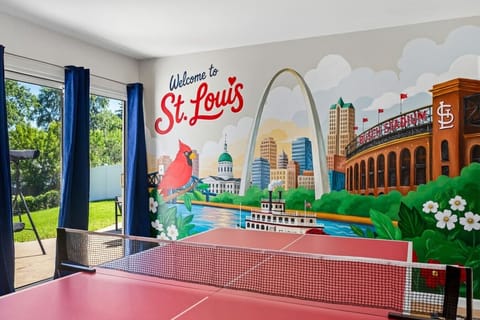 Custom hand-painted St. Louis mural showcasing iconic landmarks including the Arch, Busch Stadium, and the Mississippi River.