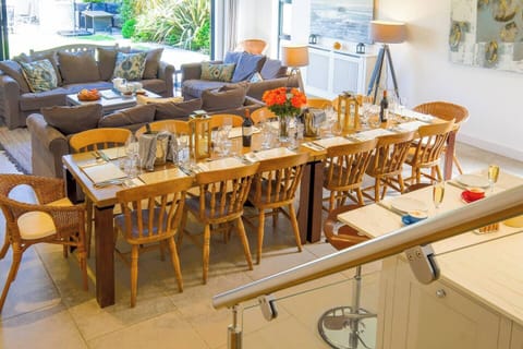 A 11 metre by 6 metre room combines Kitchen, Dining and Sitting areas, and flows out to the garden. 