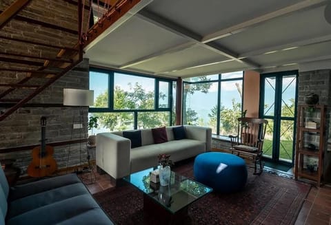 Deluxe Villa, Balcony, Garden View | Living area