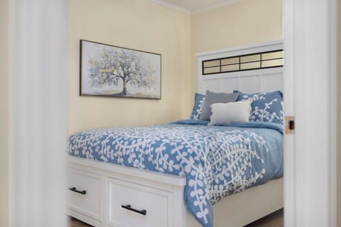 Cozy bedroom with storage bed and serene blue coastal-style decor