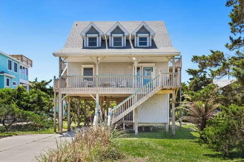 Welcome to White Dune, a charming oceanside retreat in Avon just steps from the beach.