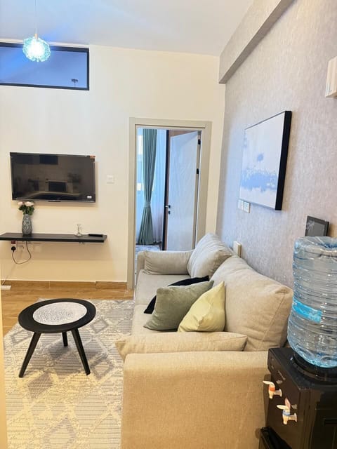 Classic Apartment, City View | Living area | 32-inch Smart TV with digital channels