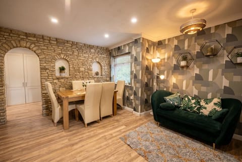 Stone arch dining nook flows into a stylish lounge for relaxed evenings