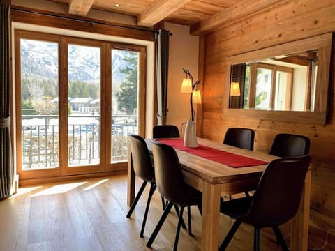 One Le Savoy - bright dining area with large windowed doors to balcony