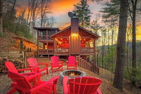 Backyard area includes fire pit, forest views. and on-property walking trail down to the creek.