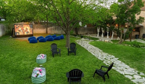 Pool by day, movies by night. Your backyard does it all—swim, play, watch, repeat.