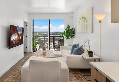 Highly designed living room with custom local art and lovely views! 75` Roku TV
