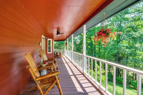 Sip coffee on the wraparound porch surrounded by shady forest