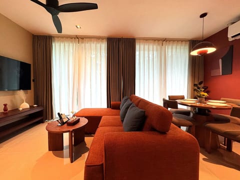 Family Suite | Living area | 32-inch Smart TV with cable channels