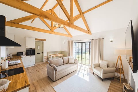 Natural light and high ceilings make the room feel even more spacious.