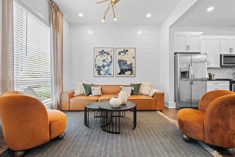 Designer living room with plush seating, western-inspired décor, and plenty of space to gather