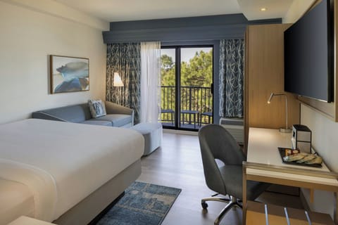 Premium bedding, desk, laptop workspace, blackout drapes