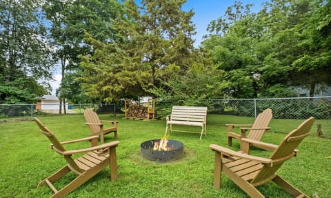 Enjoy the fenced in backyard with a fire pit and hot tub!