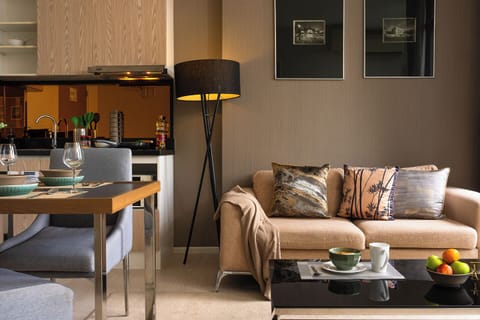 Cozy modern living space with dining area and sleek open-plan kitchen