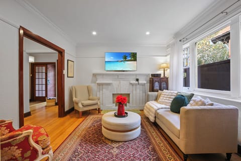 Bright lounge hardwood floors, and plush, cozy seating.